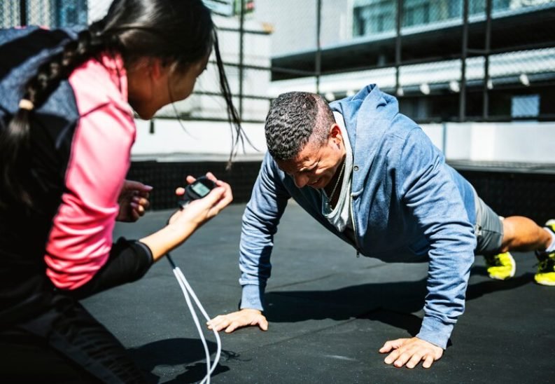 [freepicdownloader.com]-man-doing-push-up-medium