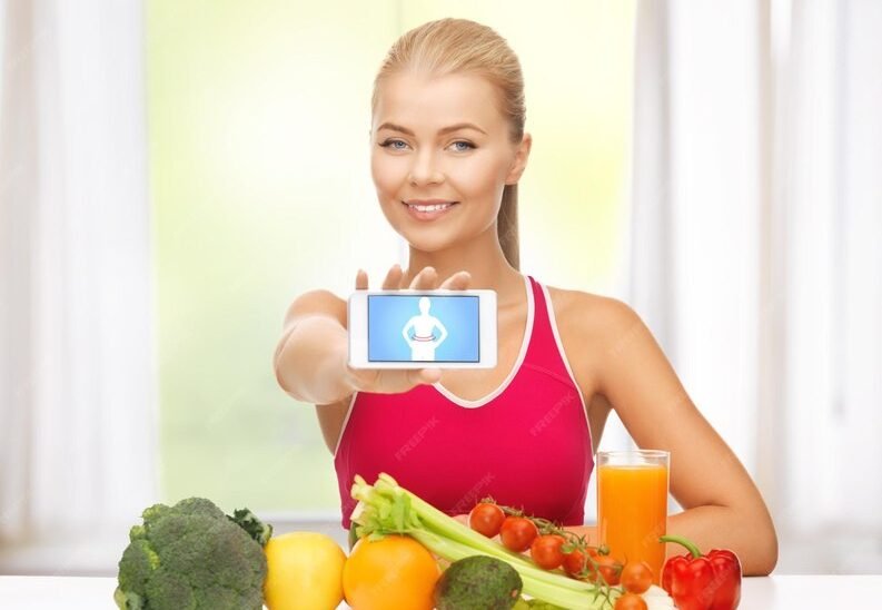 [freepicdownloader.com]-woman-with-fruits-vegetables-counting-calories-smartphone-medium